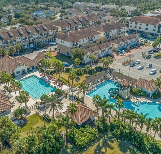 Aerial view of condo clusters and pools in Palencia